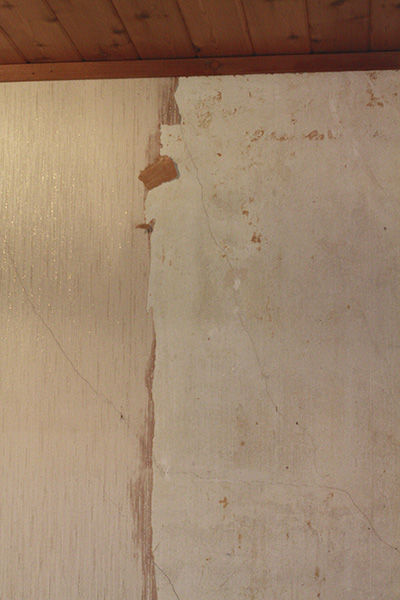 Wallpaper in the process of being removed.